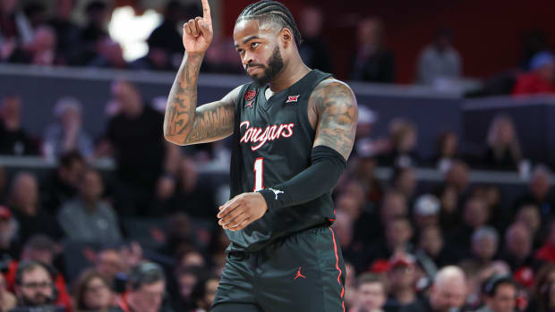 Jan 27, 2024; Houston, Texas, USA; Houston Cougars guard Jamal Shead (1) points up after a play during the second half against the Kansas State Wildcats at Fertitta Center. Mandatory Credit: Troy Taormina-USA TODAY Sports  